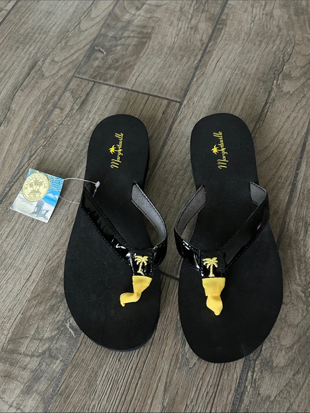 NWT…Margaritaville Black Flip Flop Sandals with Yellow Palm Accent